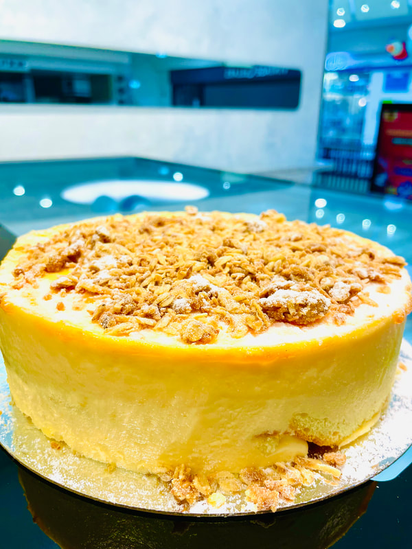 Layers of peach infused cake and a light peach mousse topped with the delicious texture of crunchy cobbler crumble.